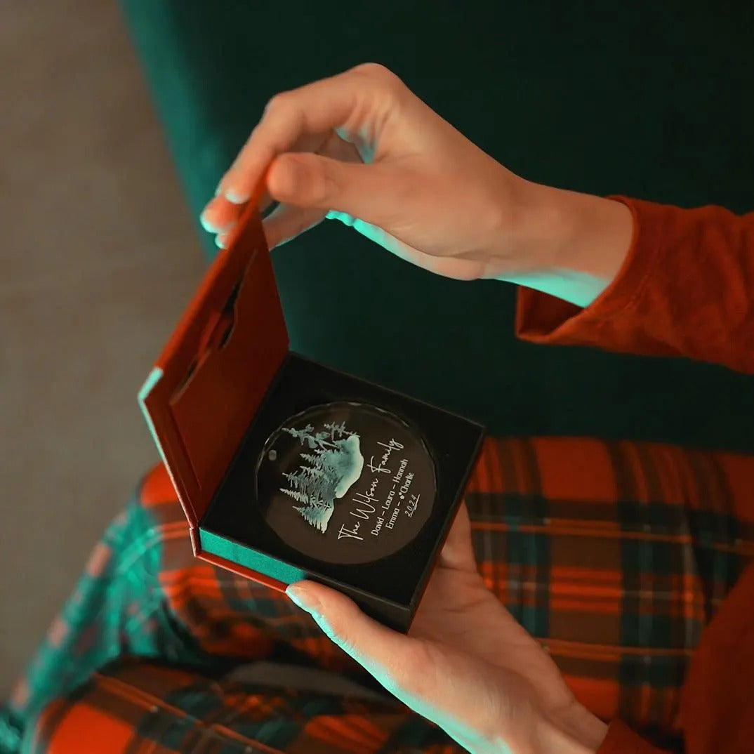 Personalized glass ornament opened from its gift box