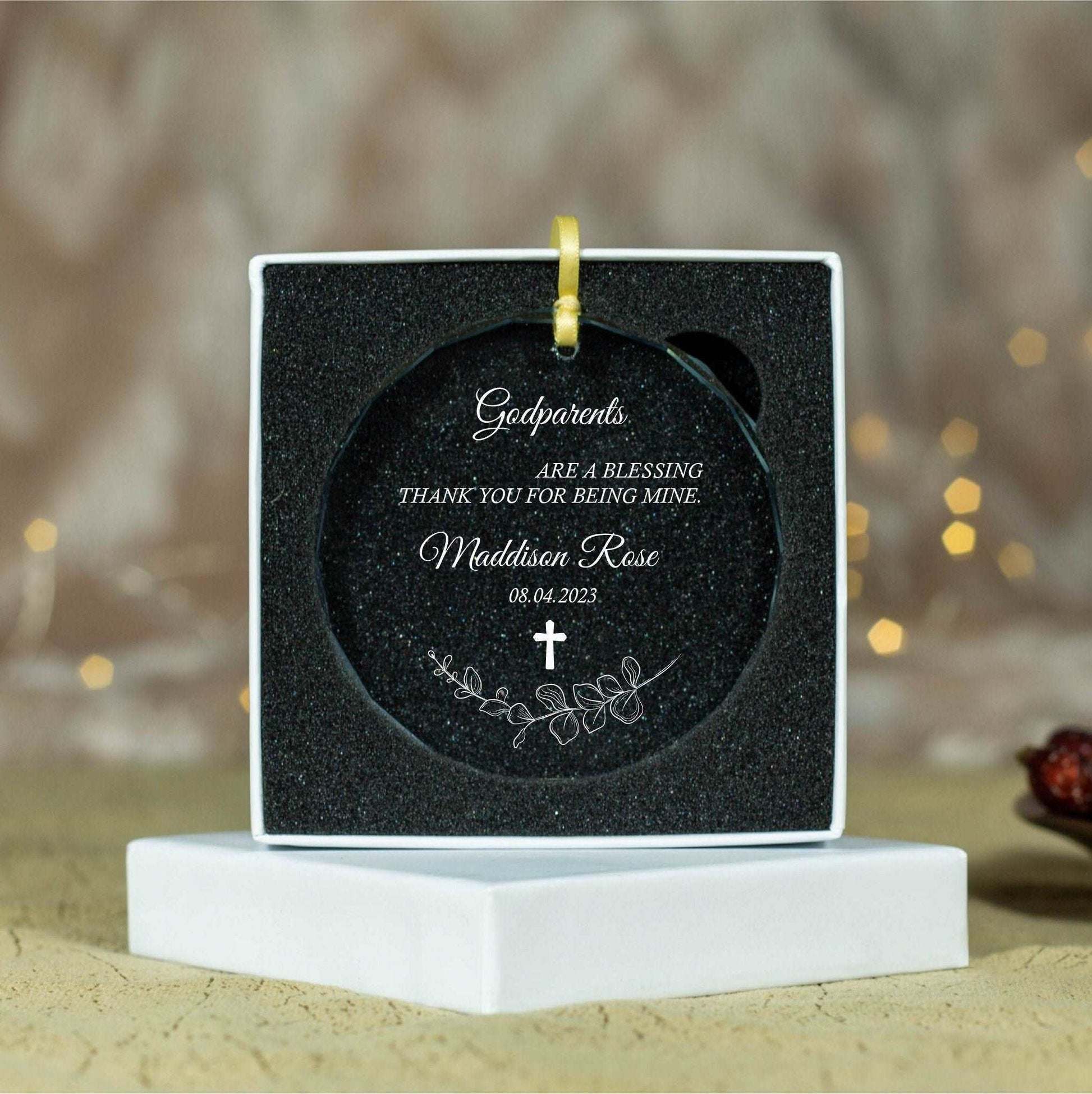 a small black plaque with a cross on it