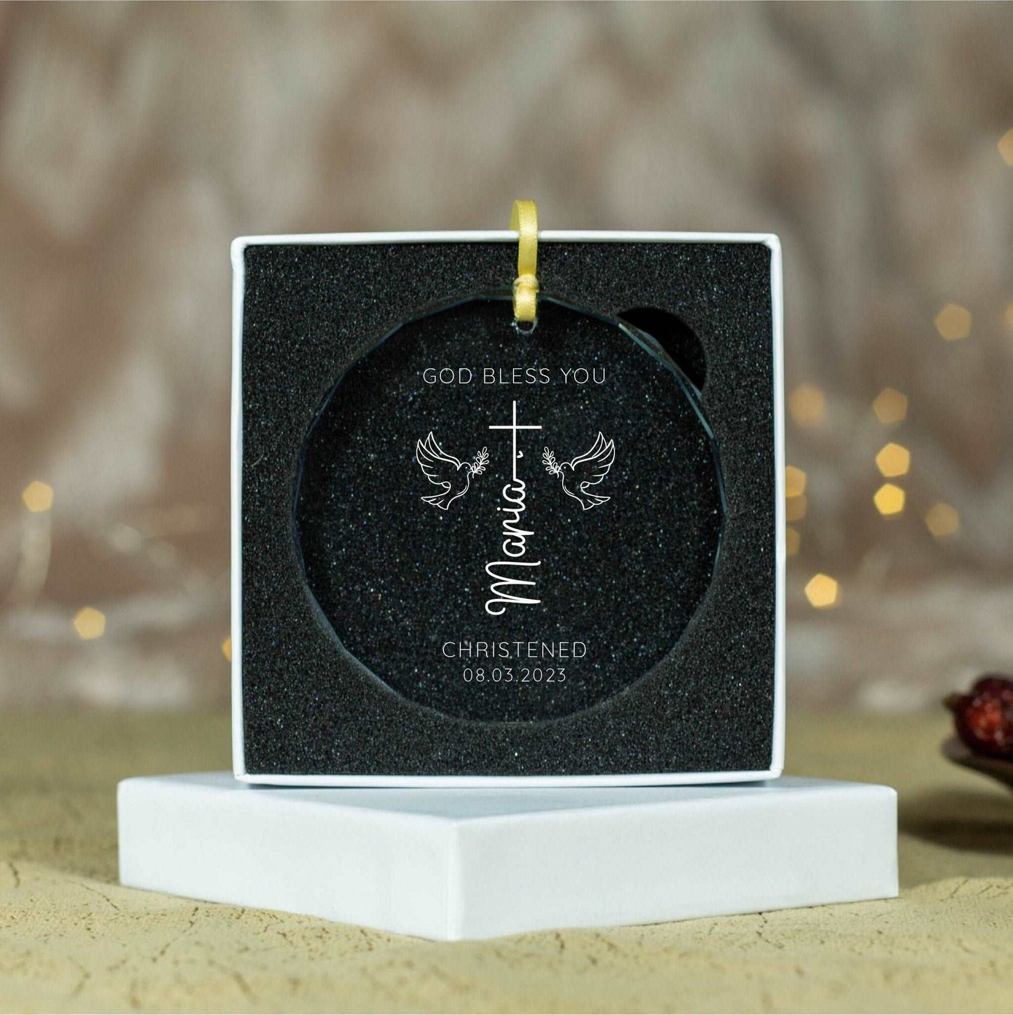 a christmas ornament with a cross on it