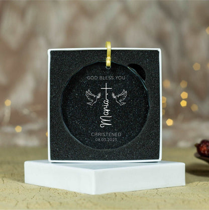 a christmas ornament with a cross on it