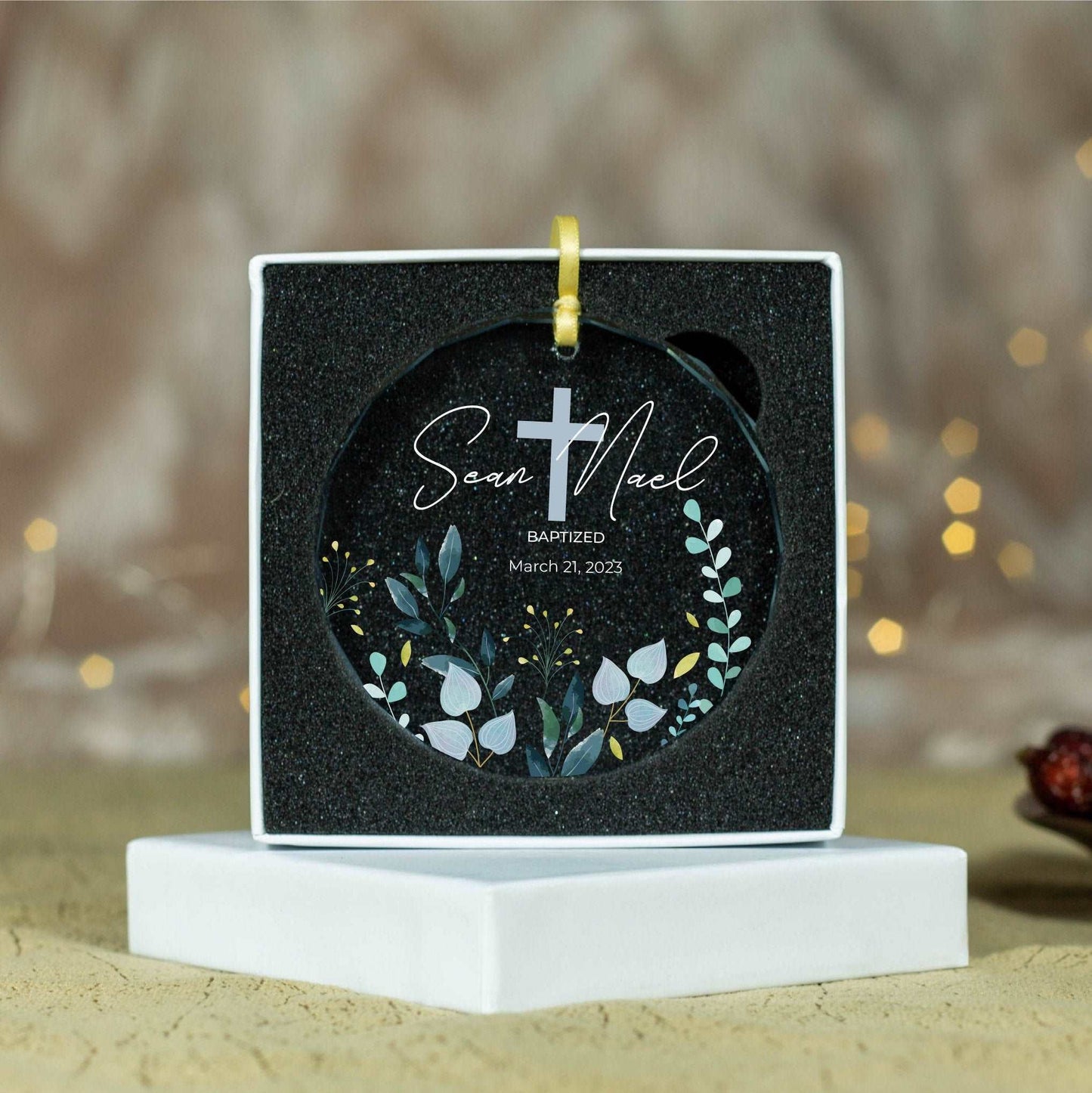 a black and white ornament with a cross on it