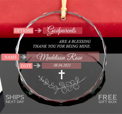 a glass ornament with a cross on it