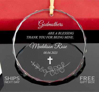 a glass ornament with a cross on it