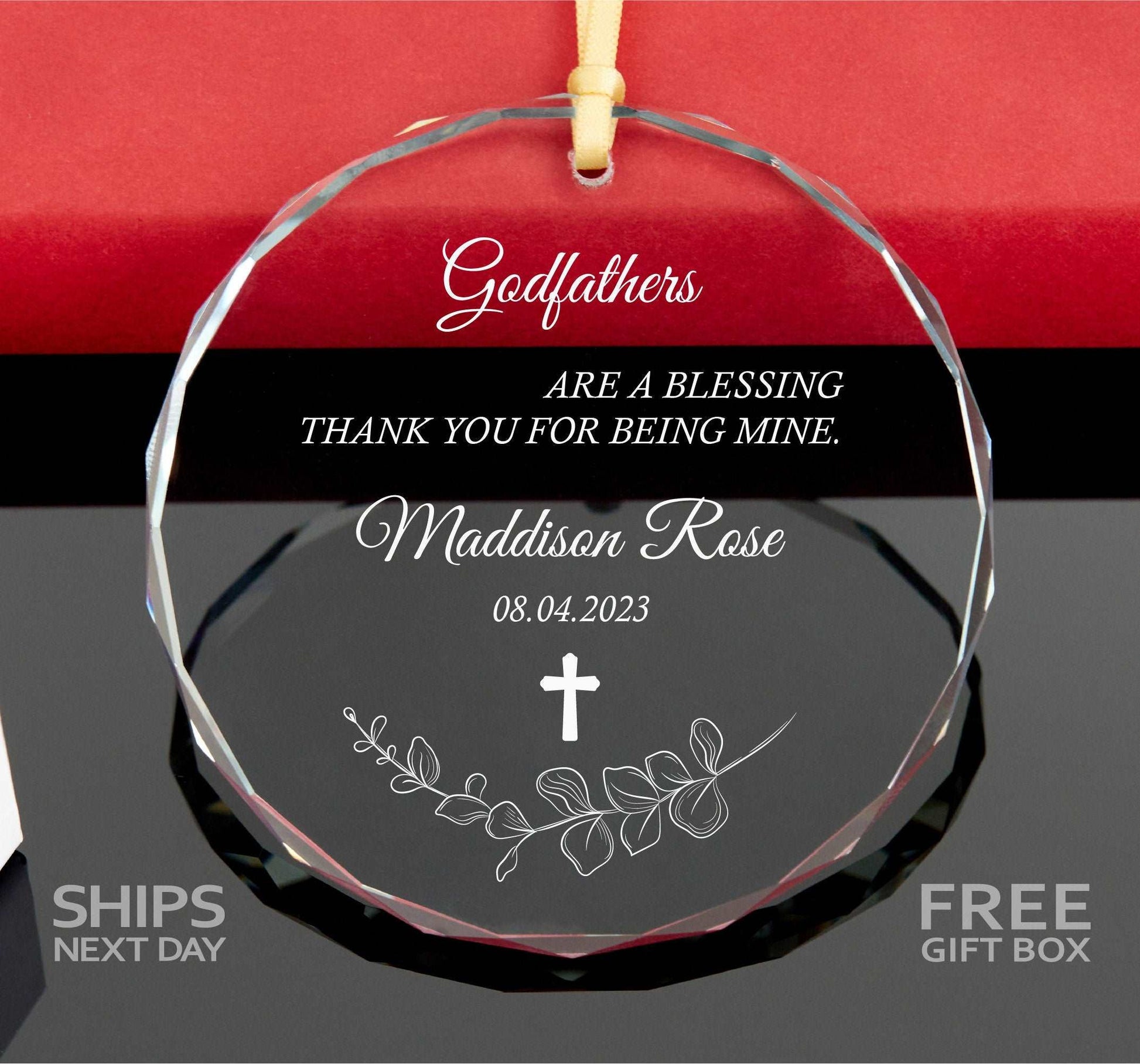 a glass ornament with a cross on it