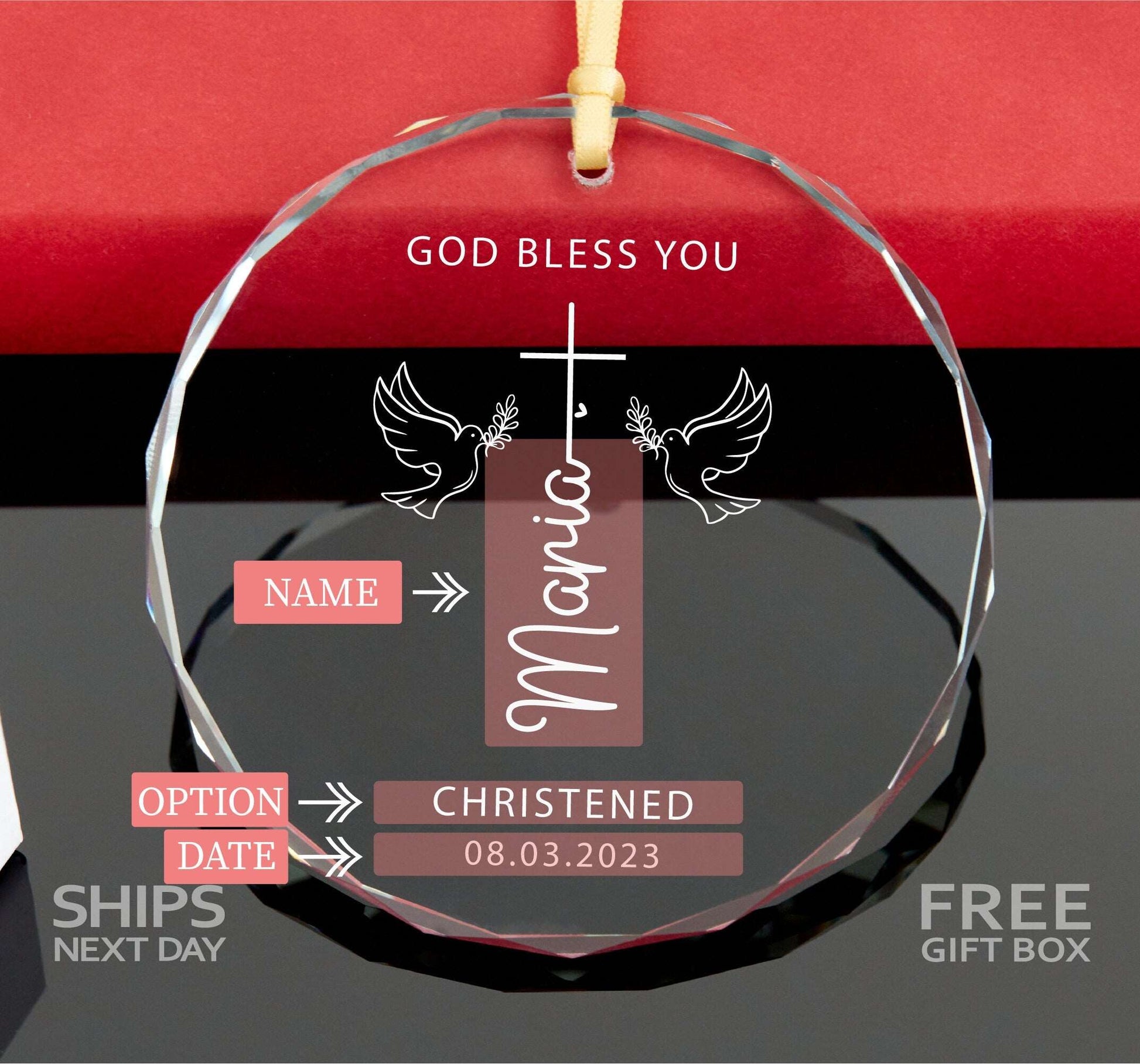 a glass ornament with a cross and doves on it