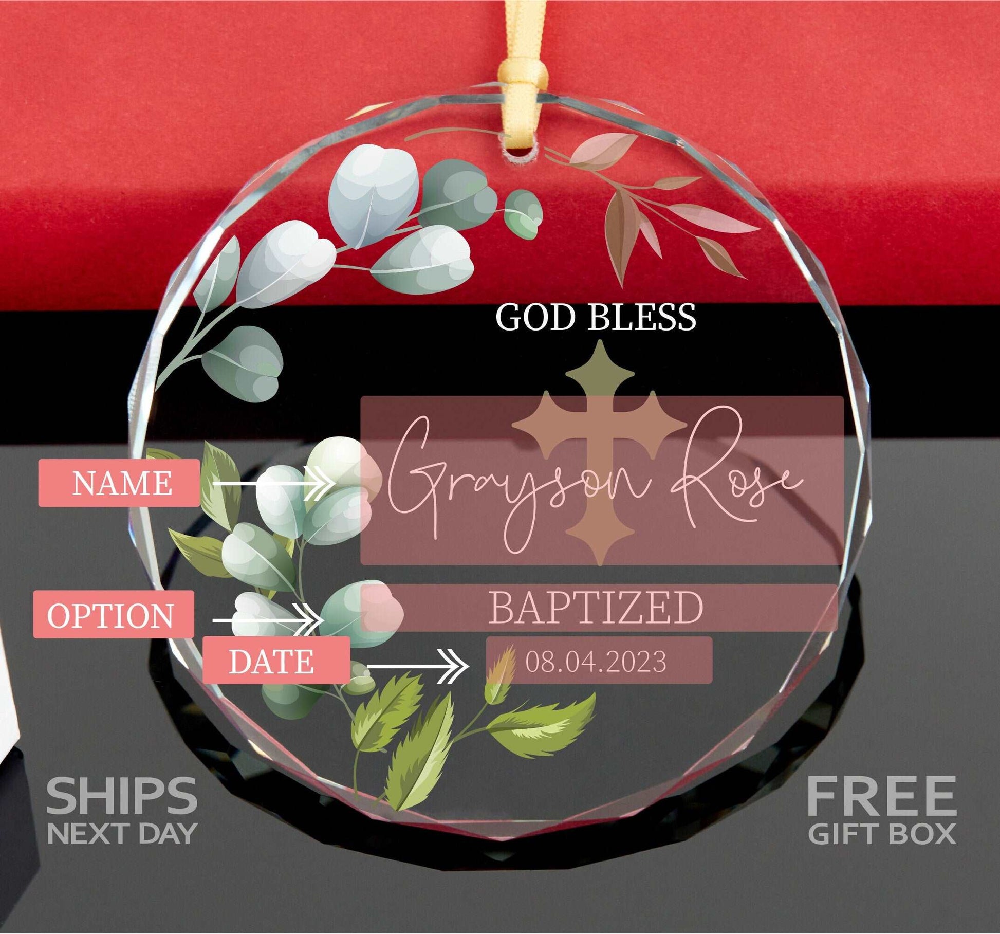 a glass ornament with a cross and flowers on it