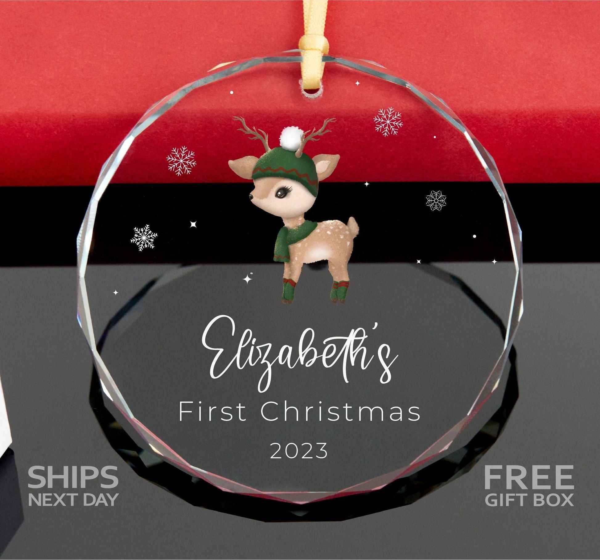 a glass ornament with a reindeer on it