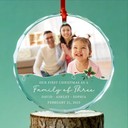 Our first Christmas as a family of three round glass photo ornament with teal holly