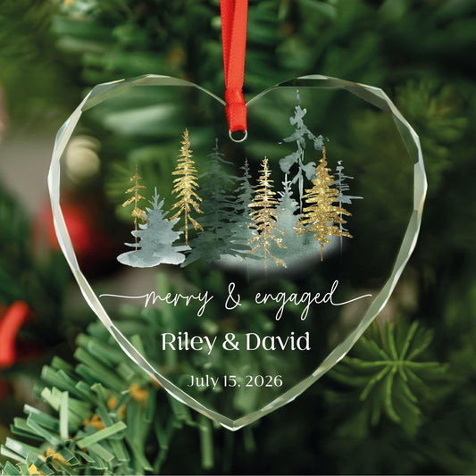 Personalized Merry and Engaged heart glass ornament with watercolor forest and gold glitter pines, names and date