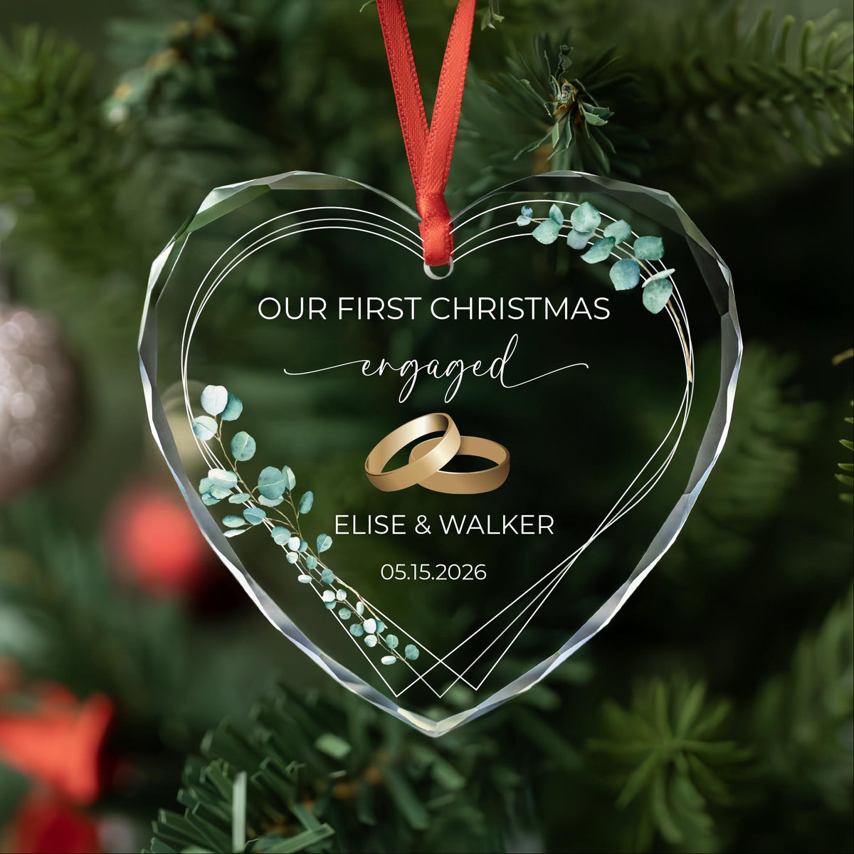 Personalized first Christmas engaged heart glass ornament with eucalyptus and gold rings, names and date