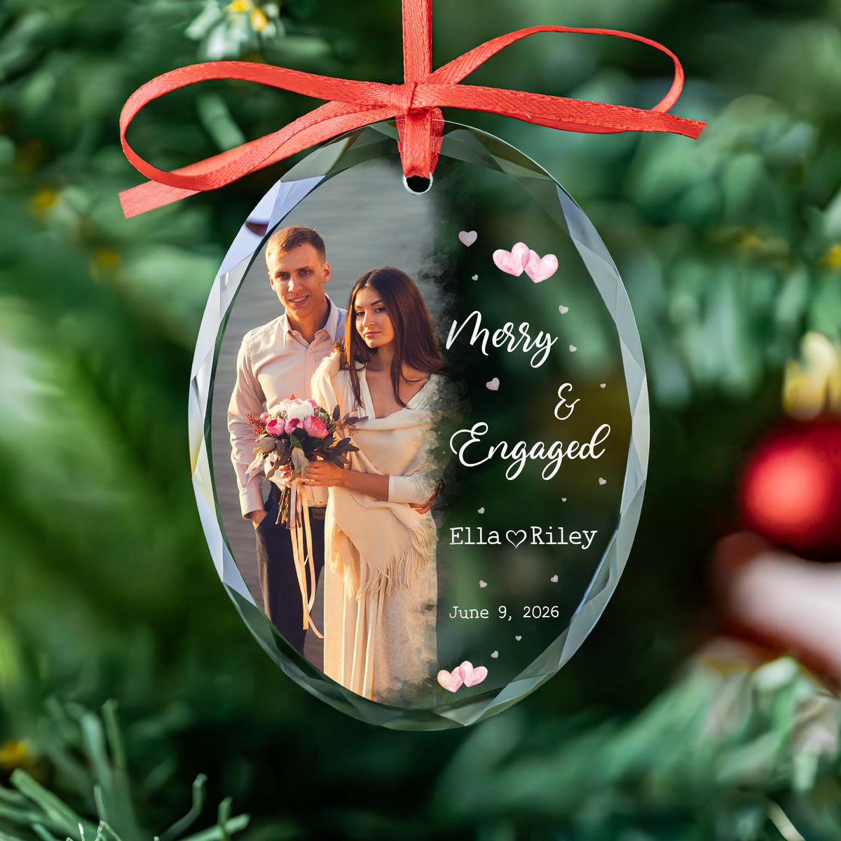 Personalized Merry and Engaged oval glass photo ornament with watercolor fade, pink hearts, names and date