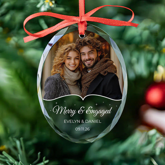 Personalized Merry and Engaged oval glass photo ornament with sparkle wave design, names and date