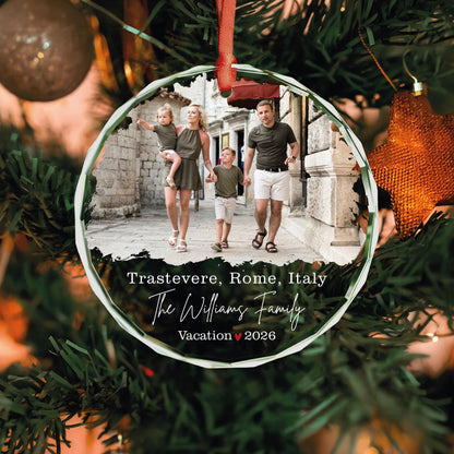 Personalized international trip photo glass ornament with family name and city